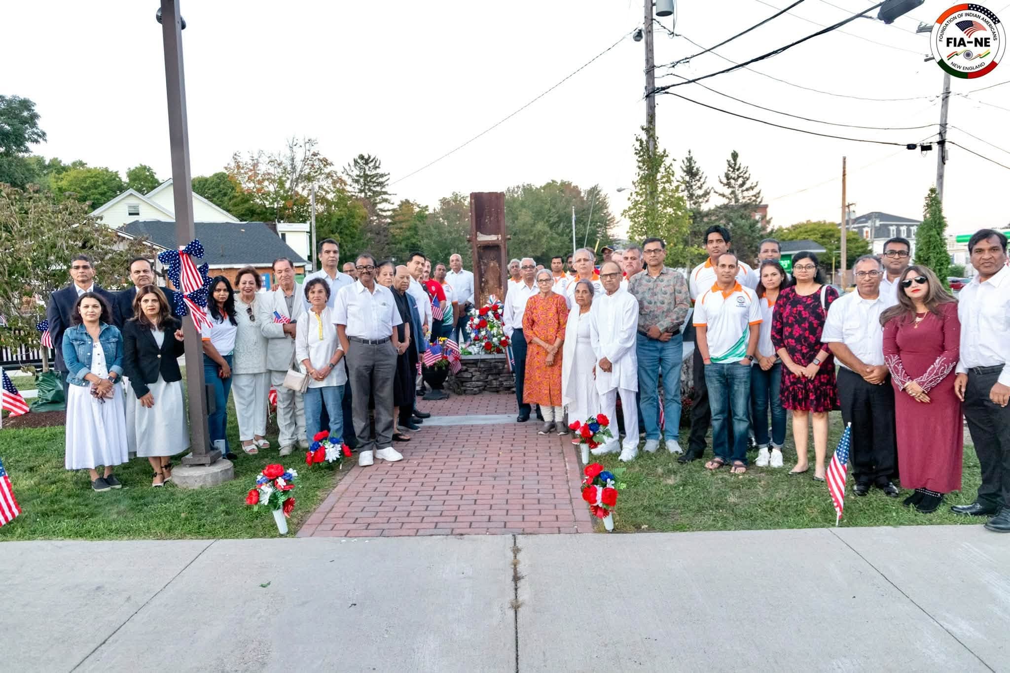 FIANE members and Westborough community members gathered together in front of the 9/11 memorial